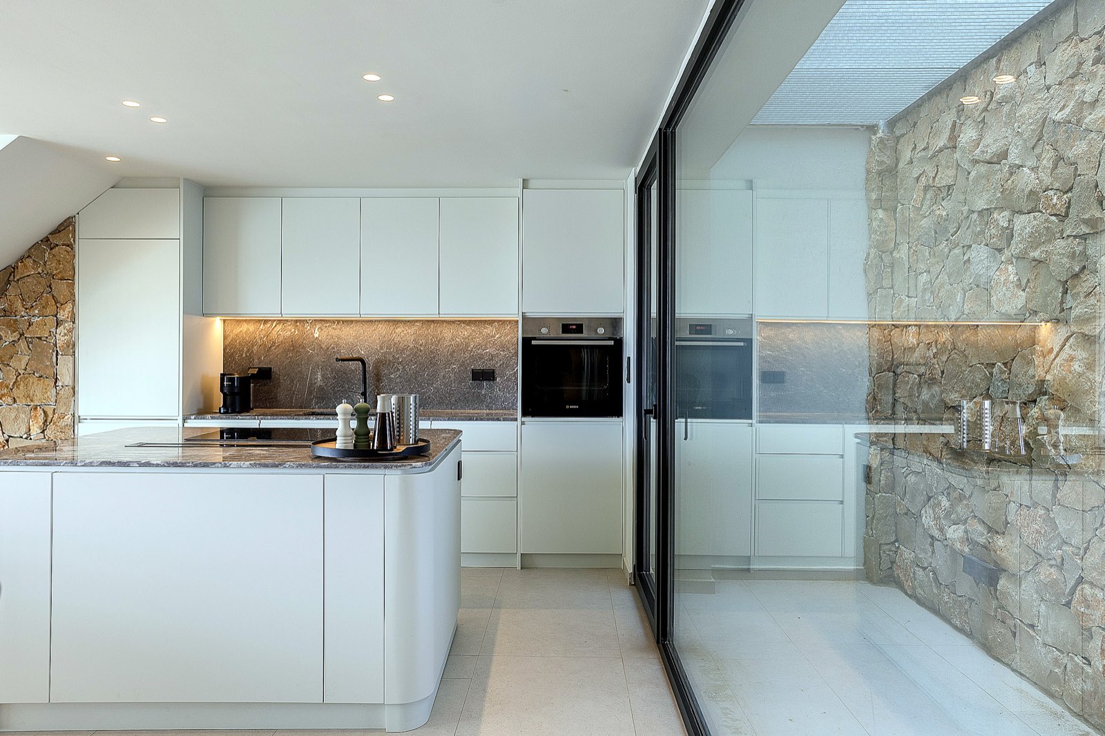 Kitchen with stone wall